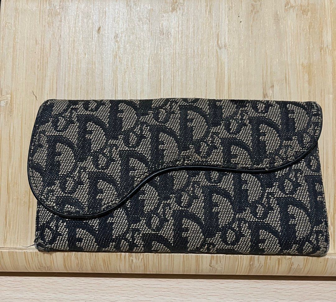 CHRISTIAN DIOR SADDLE LONG WALLET (Category: Luxury Bags & Wallets) located in San Fernando. Submitted by gemsfndr (Listing ID 1379507003, Image 1). Description: Pre-owned Guaranteed Authentic (code: 02TR 0033 - made in Italy) Can include provided chain Missing D Charm In good condition (check photos/PM for more details).