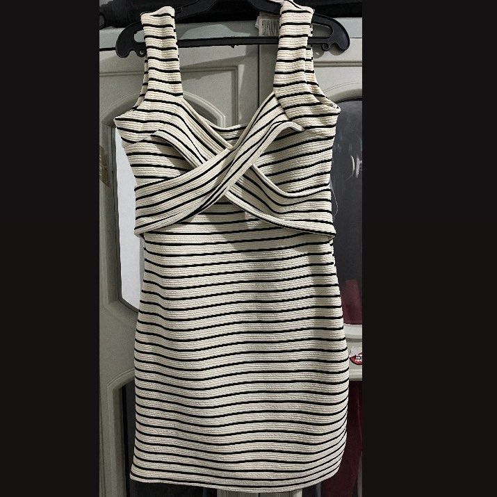 Criss-Cross Stripe Mini Dress (Category: Dresses) located in Laoag. Submitted by yve__ (Listing ID 1379443562, Image 2). Description: Condition: Slightly used Size: XS-S Color: Black and White Stripe Best for Occasions, Casual Party, Night out, or Stylish Brunch Details: Body-hugging mini dress with criss-cross bust detail and thick shoulder straps. PRICE IS NEGOTIABLE! Payment first. Please note that the shipping fee will be shouldered by the bu