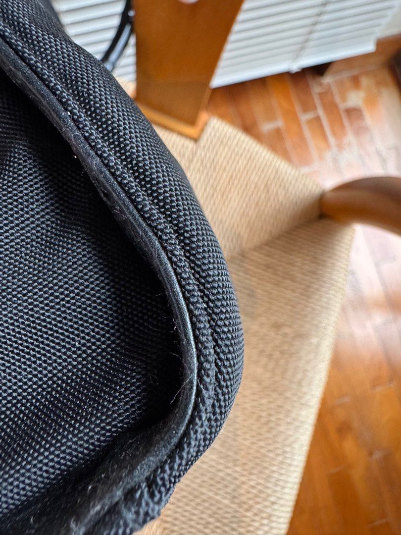 Gucci Bamboo Handle Tote Bag (Category: Bags & Wallets) located in Singapore. Submitted by frangipani77 (Listing ID 1379424349, Image 3). Description: Authentic Gucci tote bag with bamboo handles. Features a black nylon exterior and a detachable shoulder strap. The interior includes a zippered pocket and a Gucci label. Made in Italy..