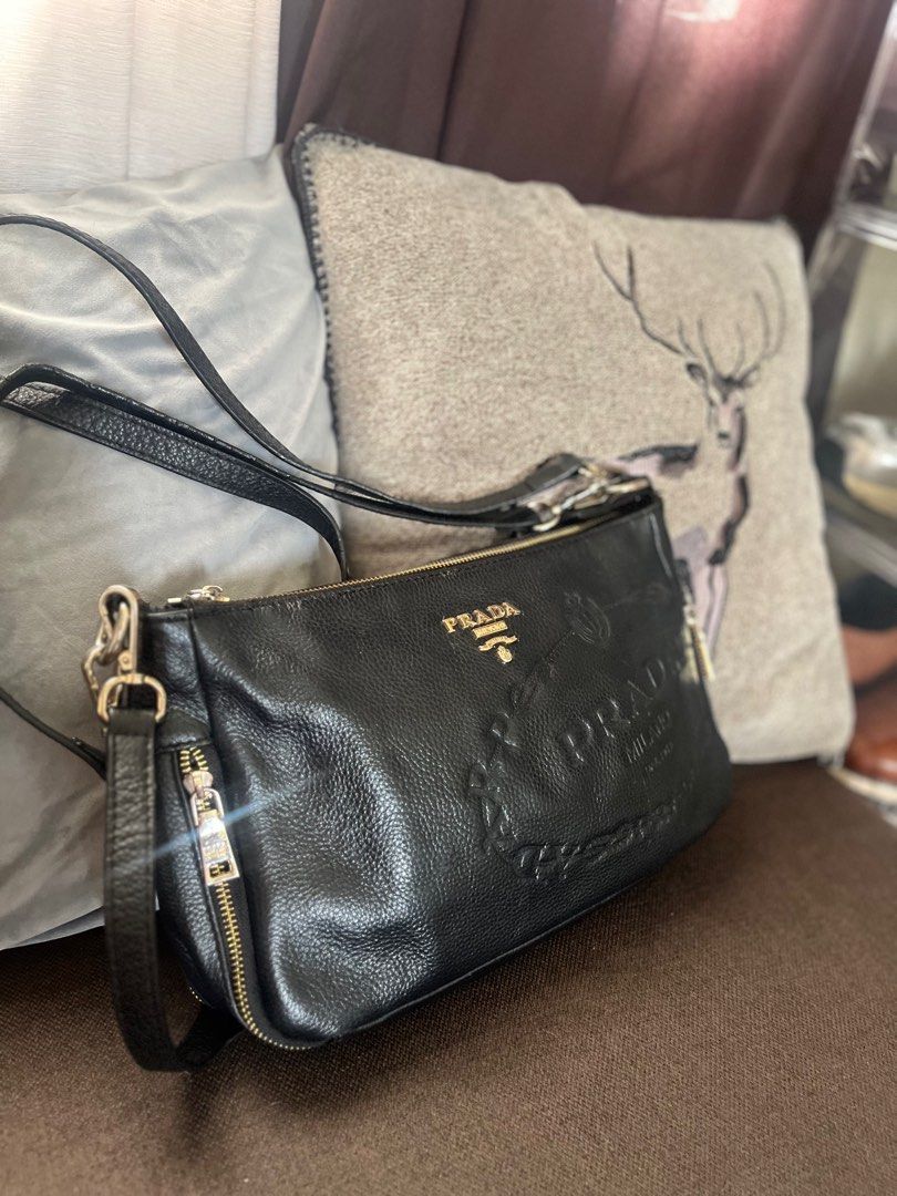 Japan Preloved Pr ^d@ leather 2 way Bag (Category: Luxury Bags & Wallets) located in Pateros City. Submitted by libertes (Listing ID 1379356183, Image 2). Description: Authentication not Guaranteed Japan Bought No flaws but has signs of usage Sobrang ganda ng leather😍 not so heavy pero makapal. 2 way, can be a kili bag and sling bag .
