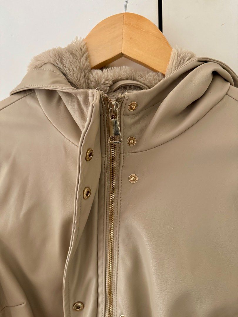 Parka/Jacket/Coat with hood (Category: Coats, Jackets and Outerwear) located in Quezon City. Submitted by 2ndtake (Listing ID 1379348971, Image 3). Description: Leatherette tan/beige parka with hood. Really nice when worn. You can see in the uploaded pictures. It has buttons and zipper. Keeps you warm. Perfect for rainy weather too. It also gives you a cinch waist when worn. Size is petite but this fits small to medium. There’s just a small porti