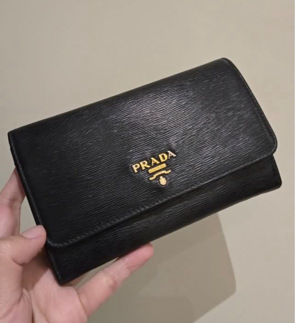 Prada Portafoglio Pattina Wallet (Category: Luxury Bags & Wallets) located in Cabanatuan. Submitted by krnlim (Listing ID 1379393934, Image 2). Description: Portafoglio Pattina Wallet Color: Nero Size: TU Preloved Authentic Prada Wallet Wrislet Complete with authenticity card, box and unused strap for wrist..