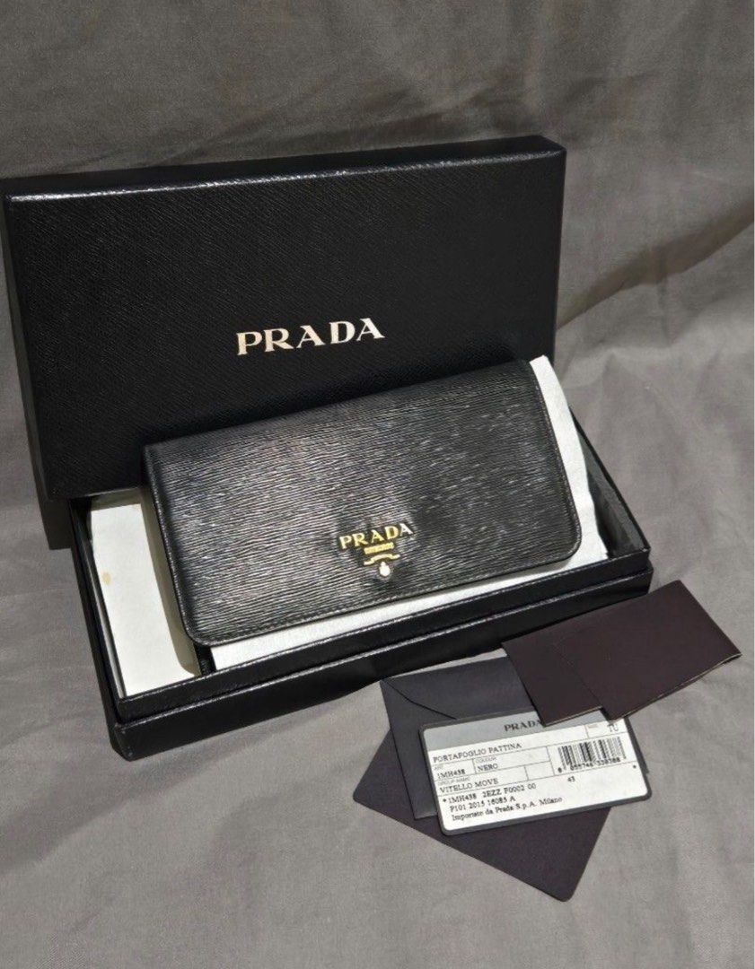 Prada Portafoglio Pattina Wallet (Category: Luxury Bags & Wallets) located in Cabanatuan. Submitted by krnlim (Listing ID 1379393934, Image 1). Description: Portafoglio Pattina Wallet Color: Nero Size: TU Preloved Authentic Prada Wallet Wrislet Complete with authenticity card, box and unused strap for wrist..