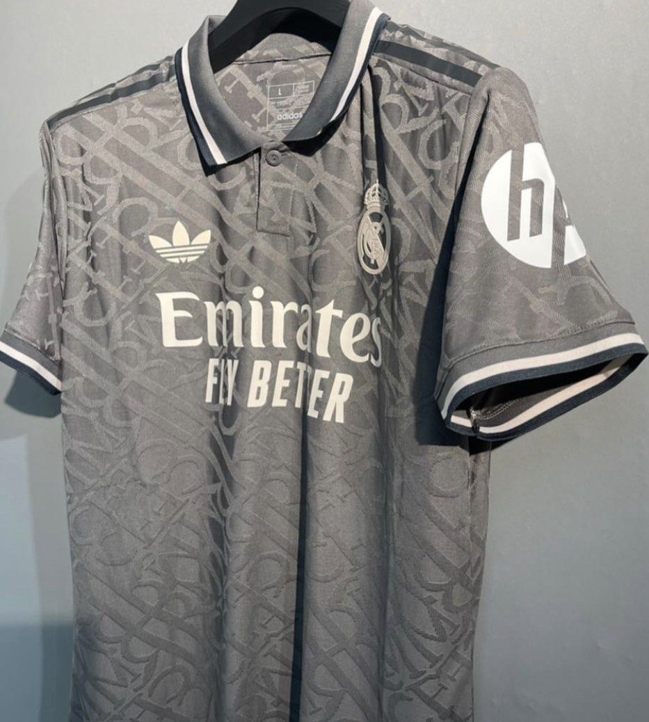 Real Madrid third kit Mbappe UCL version (Category: Activewear) located in Singapore. Submitted by footyjerseys (Listing ID 1379387136, Image 1). Description: Authentic Real Madrid jersey, featuring a unique Dior design. This jersey is a size L and features Mbappe's name and number on the back. It includes the Adidas logo and Emirates Fly Better sponsor. Perfect for fans and collectors..