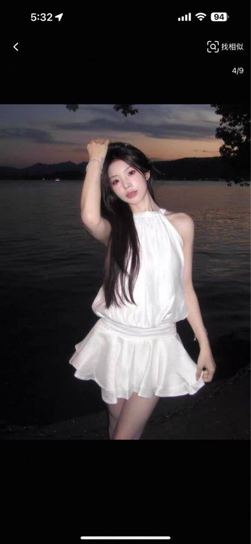 princess polly baby blue dress Beautiful Girl in a White Dress Walking on the Beach Stock Image main image 1
