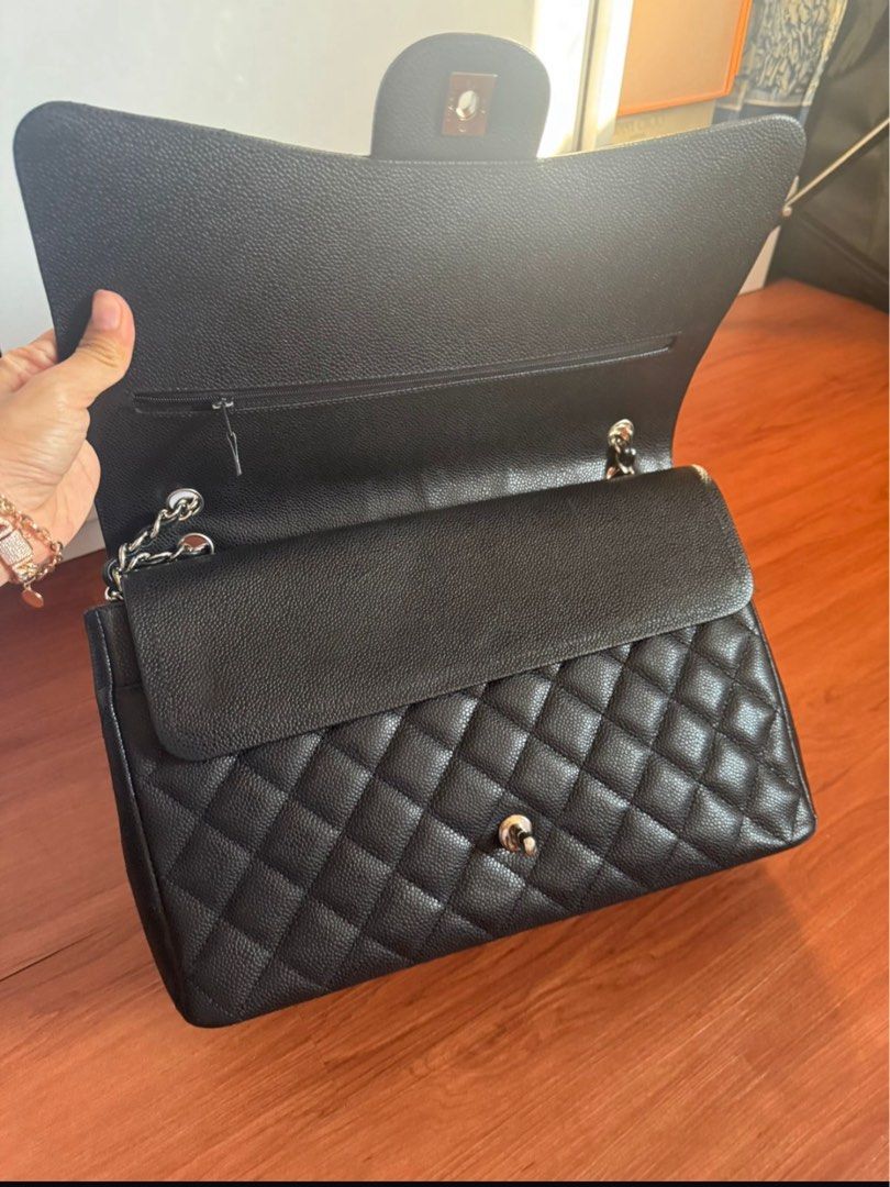 #14 Chanel Maxi Black Caviar SHW Double Flap (Category: Bags & Wallets) located in Singapore. Submitted by shahiddg (Listing ID 1379552625, Image 3). Description: Chanel Maxi CaviarSHW Double Flap 2011 (#14) Bag, Hologram,Dustbag Self collect or meet ups at tampines area or after office to flora drive authentic 100%.
