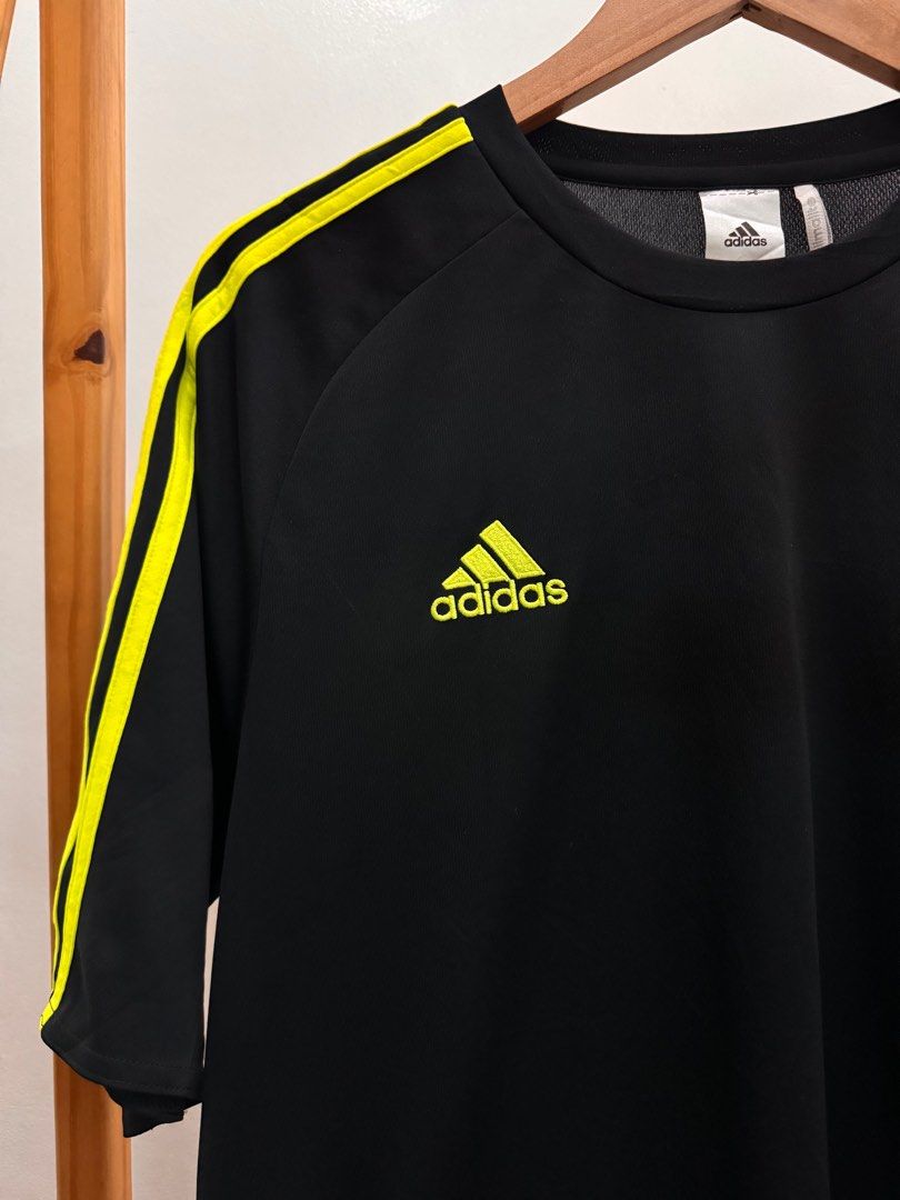 Adidas Climalite Sports Tee (Category: Activewear) located in Makati City. Submitted by thiftdirection (Listing ID 1379659268, Image 3). Description: Adidas Climalite Sports Tee Level up your game with this black Adidas performance shirt featuring neon yellow stripes and logo for that bold, athletic edge. Lightweight, breathable, and made with Climalite fabric to keep you cool and dry during every move. Perfect for training, running, or daily act