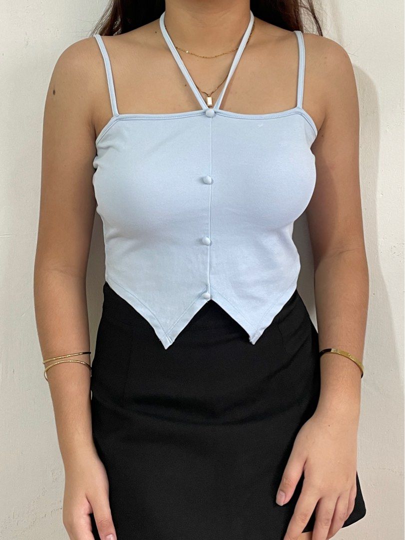 baby blue tie crop top (Category: Sleeveless) located in Quezon City. Submitted by titapple (Listing ID 1379642106, Image 2). Description: baby blue tie top, stretchy fabric, size xs-m, no flaws L: 16”” from straps W: 14” (measuring tape laid flat).