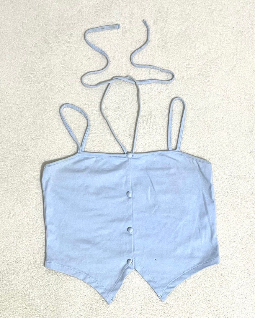 baby blue tie crop top (Category: Sleeveless) located in Quezon City. Submitted by titapple (Listing ID 1379642106, Image 3). Description: baby blue tie top, stretchy fabric, size xs-m, no flaws L: 16”” from straps W: 14” (measuring tape laid flat).