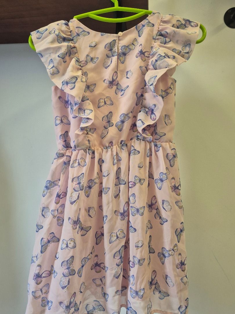 H&M Butterfly Print Dress - Size 4-5Y (Category: Babies & Kids Fashion) located in Singapore. Submitted by seasoninlife (Listing ID 1379562273, Image 2). Description: Adorable H&M dress featuring a lovely butterfly print, size 110. The dress has a comfortable fit with a gathered waist and flutter sleeves. Perfect for a little girl's wardrobe. In excellent condition, ready to wear!.