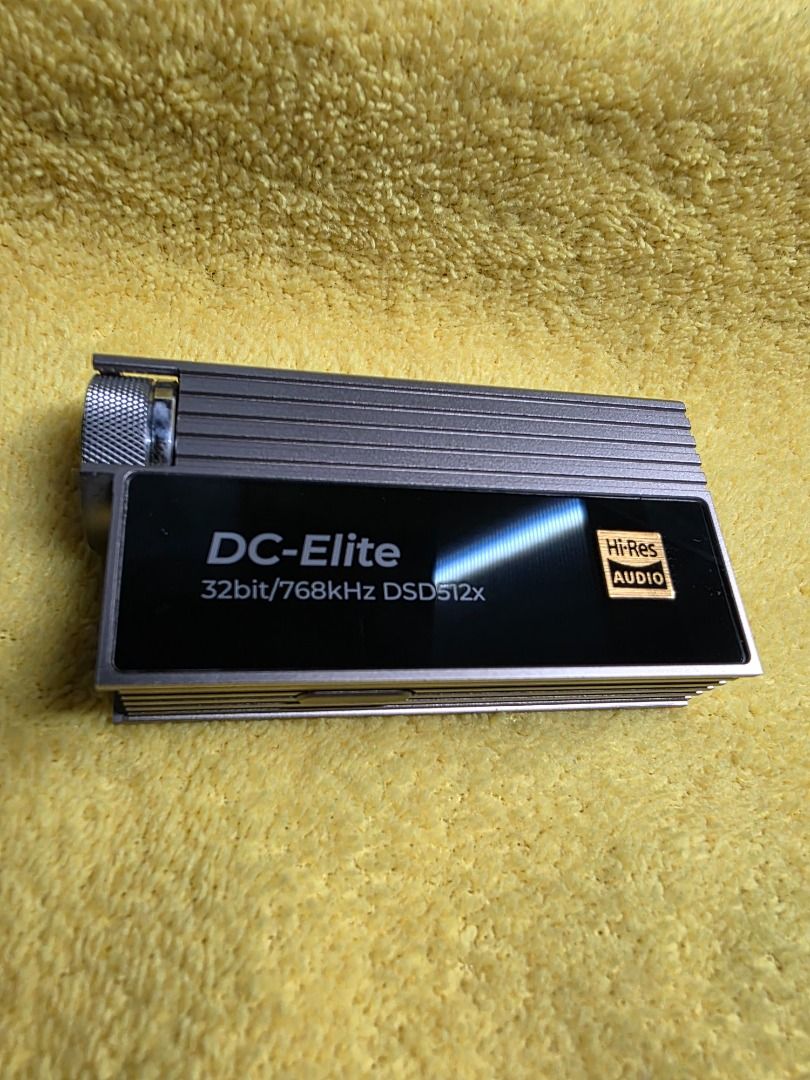 IBASSO DC ELITE TITANIUM DAC (Category: Portable Audio Accessories) located in Imus. Submitted by gadgetphoenix (Listing ID 1379716788, Image 2). Description: IBASSO DC ELITE TITANIUM DAC SELLING PRICE: 23,999 PHP The iBasso DC Elite is widely considered the "Final Boss" of dongle DACs, as it essentially shrinks the architecture of the flagship DX320MAX into a portable frame. Highlighting the Aerospace-grade Titanium and the 24-step stepped atten