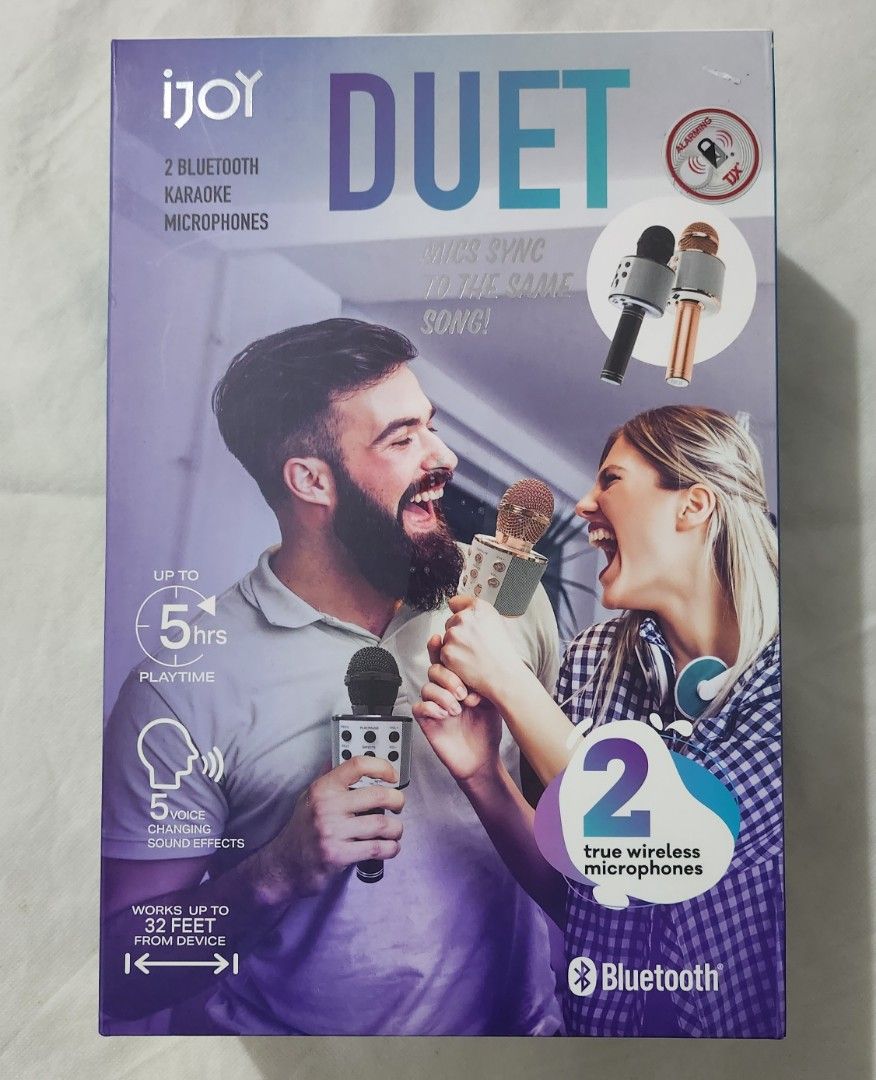 IJOY 2 Bluetooth Karaoke Microphone Duet Mics Sync (Category: Microphones) located in Marikina City. Submitted by mgfc926 (Listing ID 1379570307, Image 1). Description: The image shows the iJoy Duet 2-Pack True Wireless Bluetooth Karaoke Microphones. S Features: This set includes two Bluetooth-enabled wireless microphones for a duet experience offering up to 5 hours of playtime and a range of up to 32 feet from the connected device. S Voice Effec