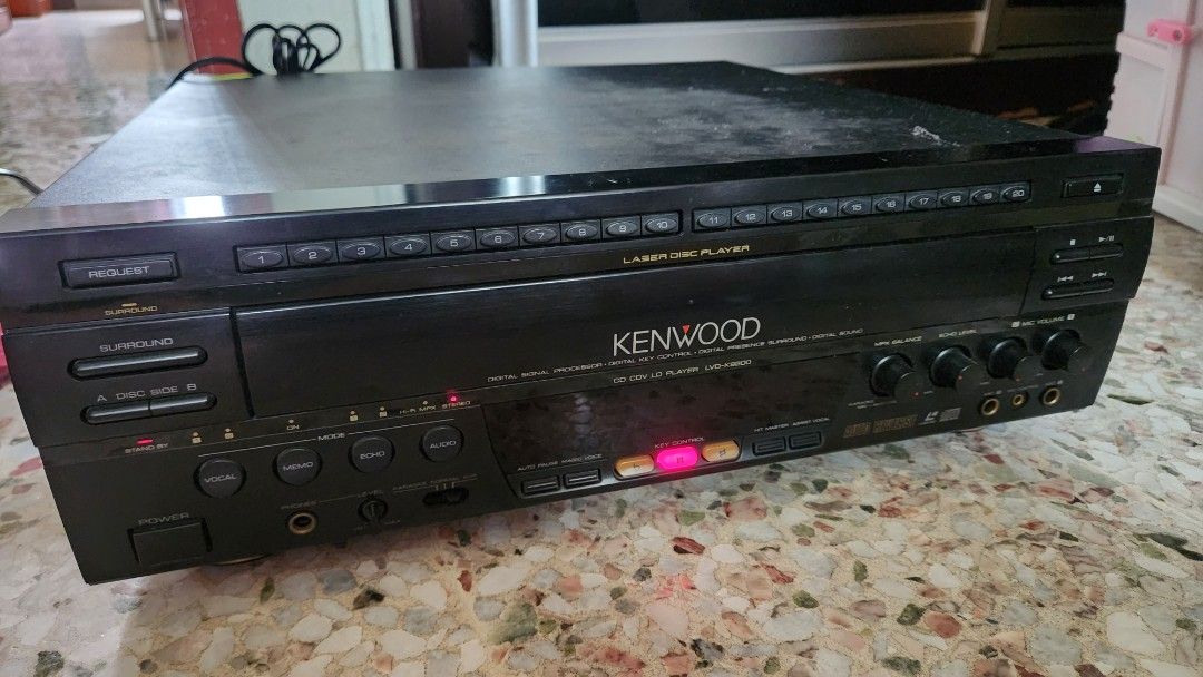 Kenwood LD/CD player ( Can power On / tray cannot open) (Category: Other Audio Equipment) located in Singapore. Submitted by paulsuede (Listing ID 1379548355, Image 3). Description: Kenwood LD/CD player ( Can power On / tray cannot open) selling for those who knows how to repair or for parts. still can power as shown in photos. please bring your own bag (no remote).