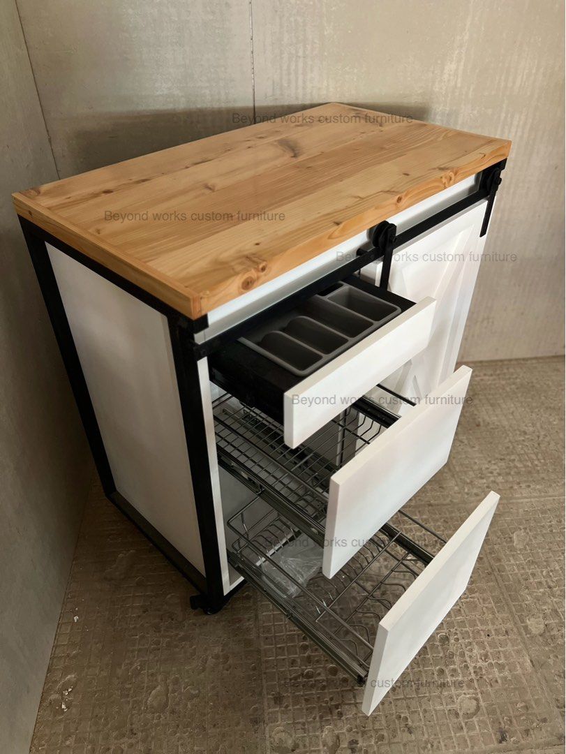 Kitchen Cabinet with pull out dish rack (Category: Food Organization & Storage) located in Manila. Submitted by jennyromulo (Listing ID 1379529079, Image 1). Description: Kitchen Cabinet with pull out dish rack Solid Wood Top- Sliding Barn Door White Duco Finish.