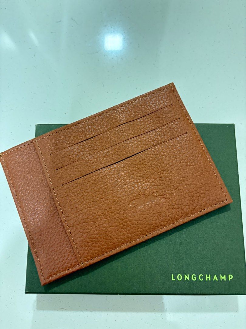 Longchamp Leather Card Holder - Brown (Category: Bags & Wallets) located in Singapore. Submitted by bbhuat (Listing ID 1379631581, Image 2). Description: Brand new Longchamp card holder. Made of textured leather. Comes with original box. Features multiple card slots for easy organization. A stylish and practical accessory for everyday use..