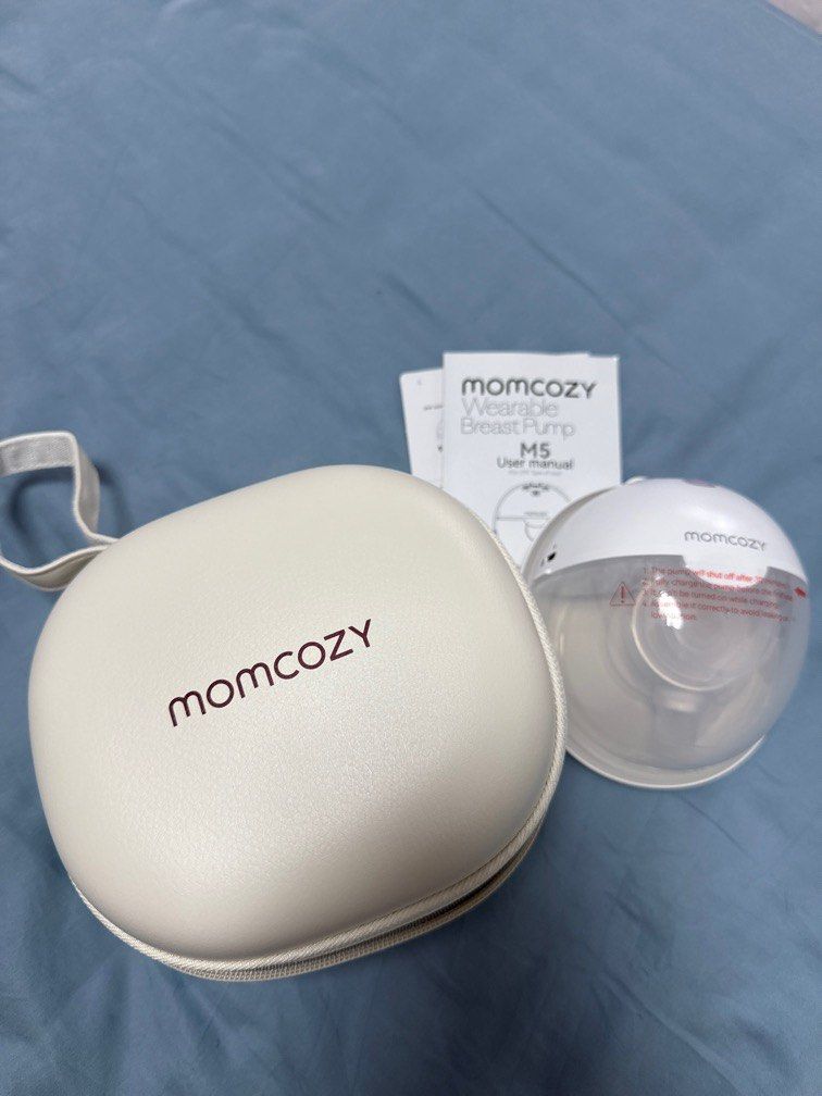Momcozy pump M5 (Category: Breastfeeding & Bottle Feeding) located in Singapore. Submitted by cloakanddaggersg (Listing ID 1379539666, Image 1). Description: No box, only as per pic. Took everything out then decided not to use. Haven’t wash or sanitize, sticker still intact.