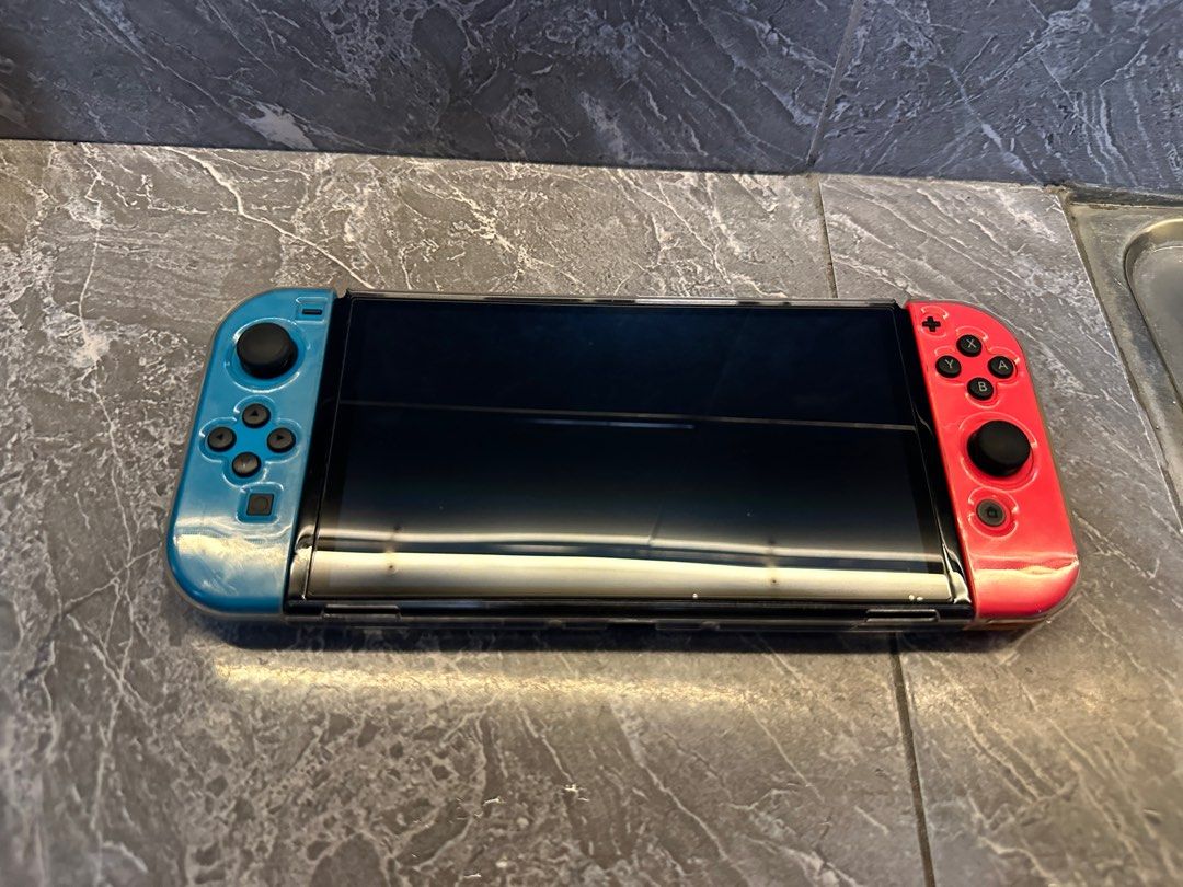 NINTENDO SWITCH OLED (Category: Nintendo) located in Santa Rosa. Submitted by jmcan (Listing ID 1379709990, Image 2). Description: RUSH RUSH RUSH NINTENDO SWITCH OLED with Box With extra joy con 3 games GTA V, NBA 2k25 (new binuksan lang pero di nalaro) IT TAKES TWO HARD CASE CASE Extra glass film Good as new Lady Owned 14k asking price slightly nego! Meet Up Cabuyao to Santa Rosa Can do lalamove or lbc (shoulder fee of buyer) Unli Check for meet