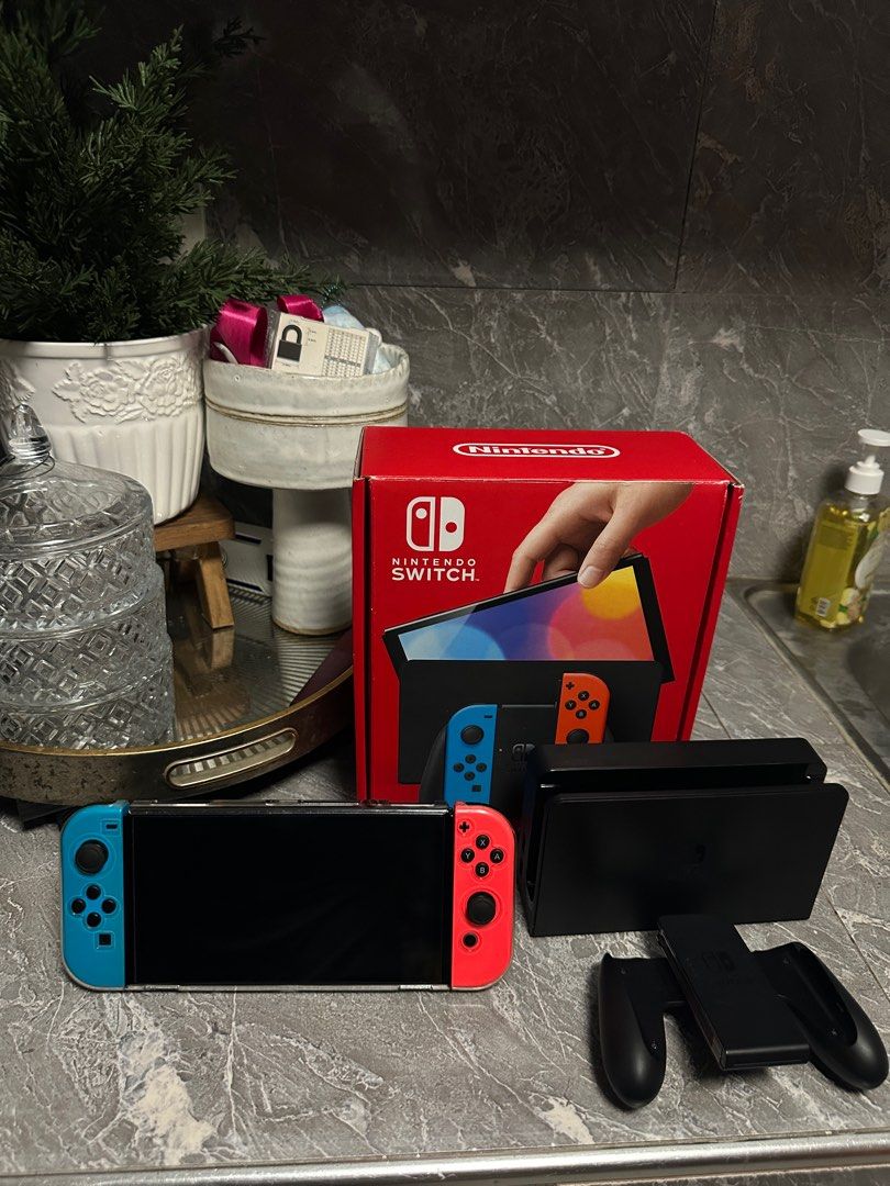 NINTENDO SWITCH OLED (Category: Nintendo) located in Santa Rosa. Submitted by jmcan (Listing ID 1379709990, Image 1). Description: RUSH RUSH RUSH NINTENDO SWITCH OLED with Box With extra joy con 3 games GTA V, NBA 2k25 (new binuksan lang pero di nalaro) IT TAKES TWO HARD CASE CASE Extra glass film Good as new Lady Owned 14k asking price slightly nego! Meet Up Cabuyao to Santa Rosa Can do lalamove or lbc (shoulder fee of buyer) Unli Check for meet