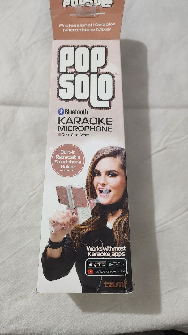 Pop Solo Bluetooth Karaoke Microphone (Category: Microphones) located in Marikina City. Submitted by mgfc926 (Listing ID 1379559953, Image 3). Description: This image displays the Tzumi PopSolo Wireless Bluetooth Karaoke Microphone. S Product: Tzumi PopSolo Wireless Bluetooth Karaoke Microphone. Features: It includes a built-in retractable smartphone holder and connects via Bluetooth for karaoke. Compatibility: Works with most karaoke apps and Yo