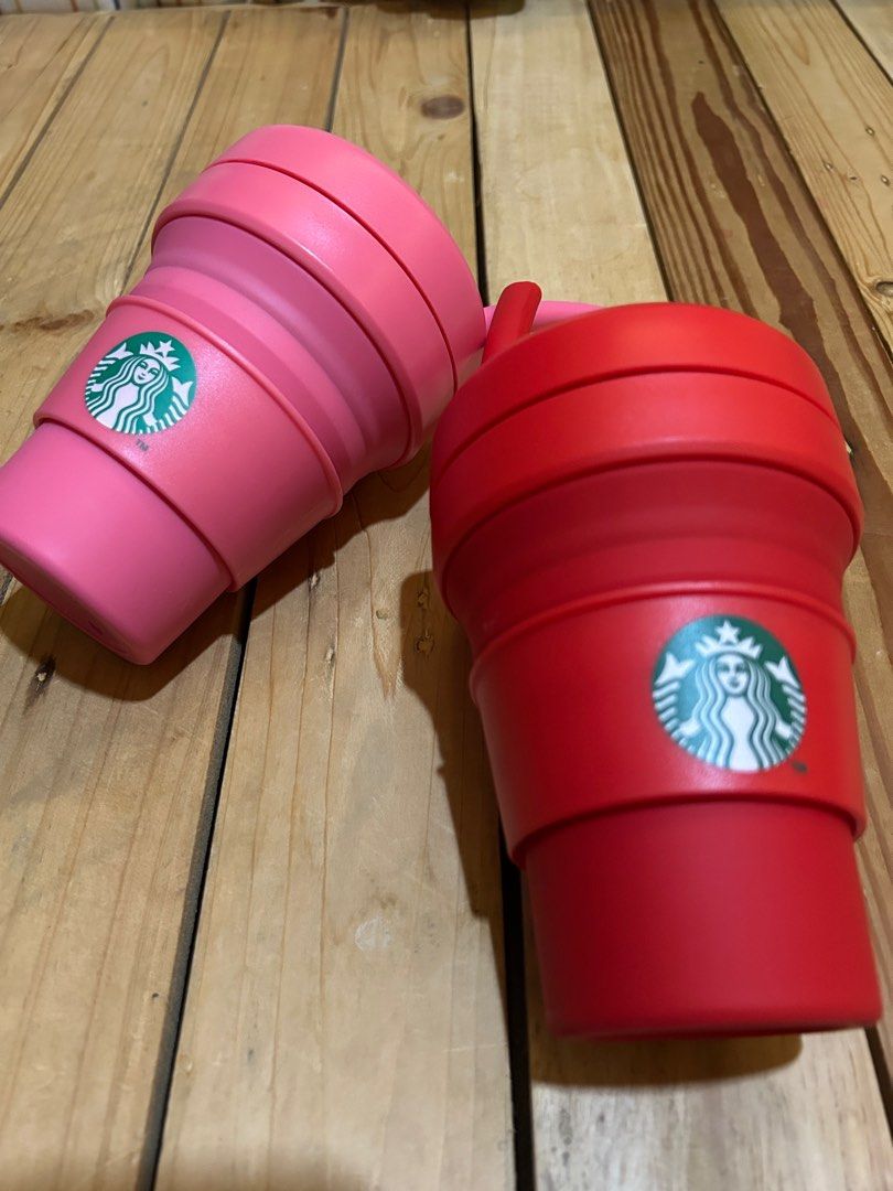 Starbucks x Stojo Collapsible Small Cup (Category: Water Bottles & Tumblers) located in Lipa City. Submitted by lifestyled (Listing ID 1379594586, Image 1). Description: Starbucks x Stojo Collapsible Small Cup Red and Pink Color It’s made from food-grade, recyclable materials, is glue-free, and dishwasher-safe. The cup is designed for both hot and cold beverages and features a leak-proof lid. Price per piece 💯 Authentic.
