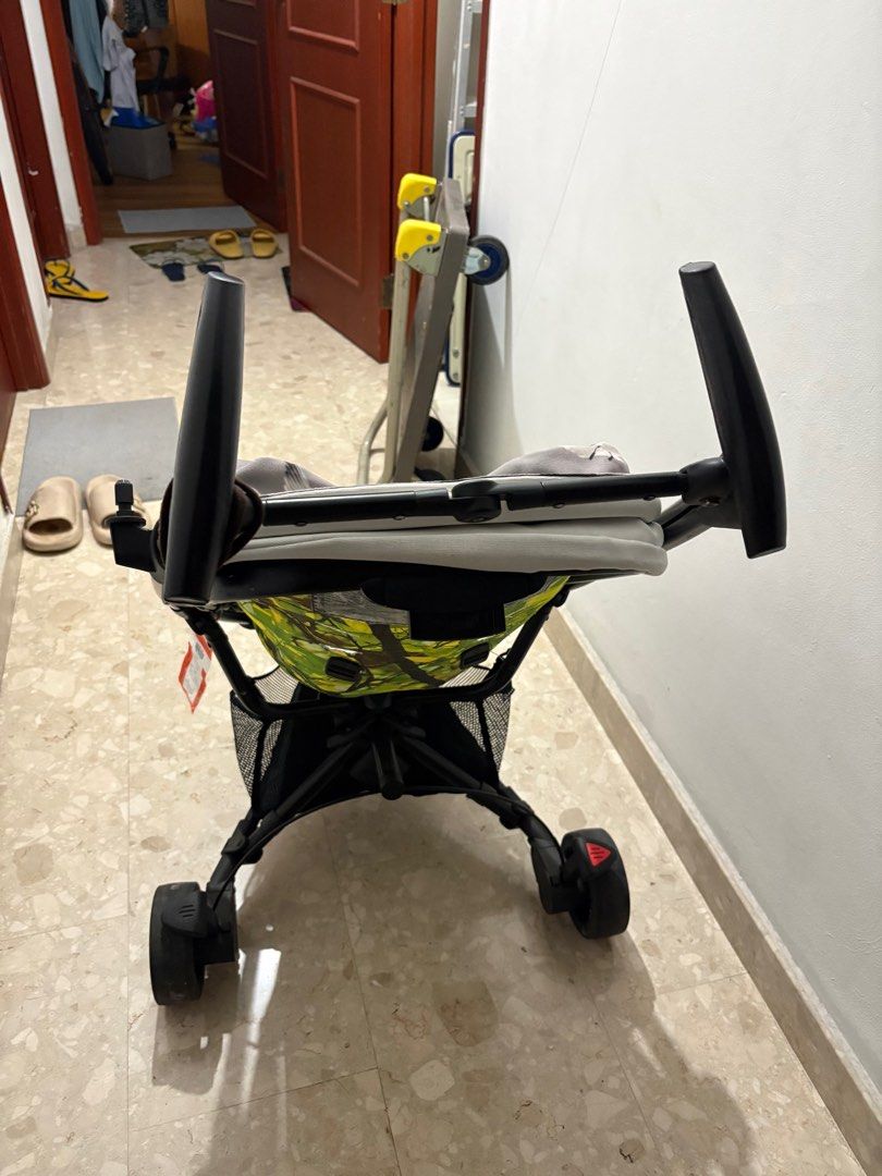 Quinny Zapp- Stroller - Green (Category: Strollers) located in Singapore. Submitted by reymondginos (Listing ID 1379585897, Image 1). Description: stroller in good condition. Features a vibrant green and white patterned seat. Includes a storage basket underneath. Folds up for easy storage and transport. Minor wear and tear visible, but fully functional..