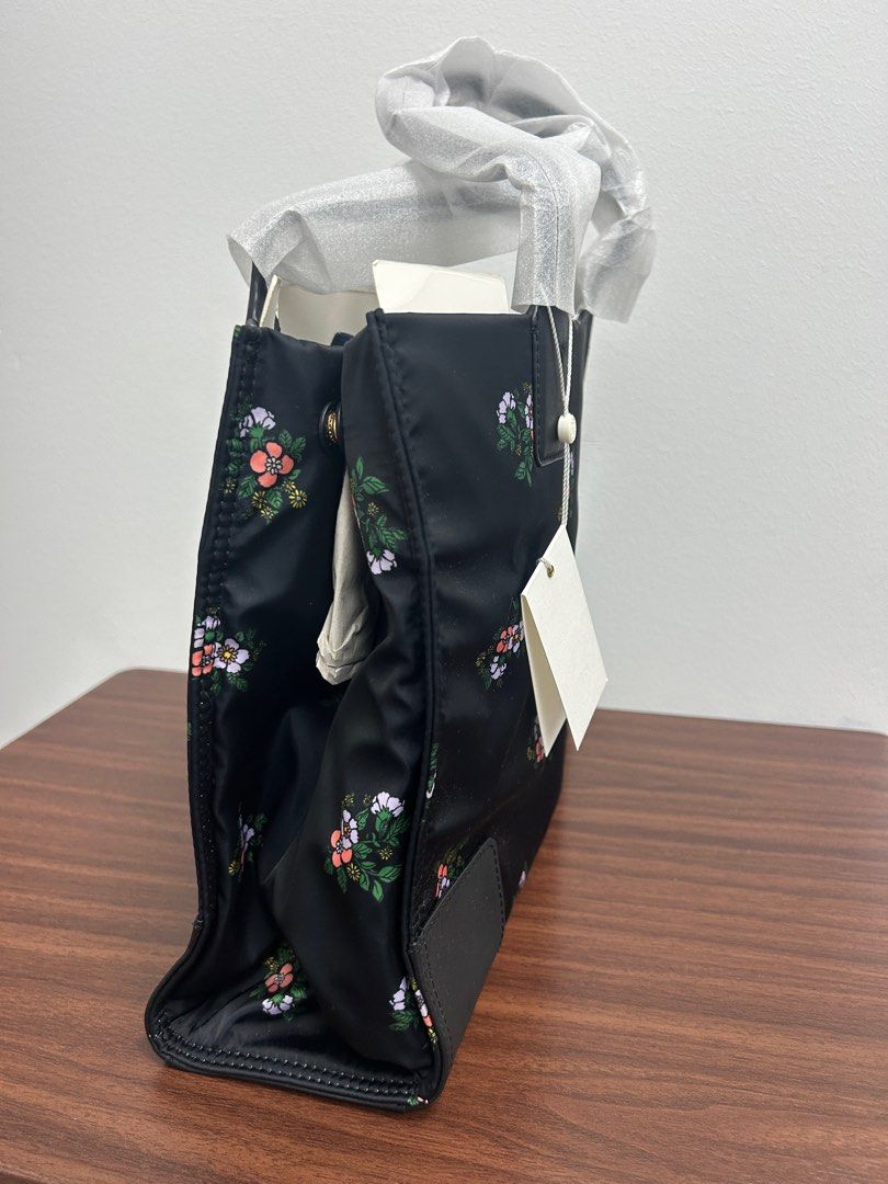Tory Burch Floral Mini Tote Bag - Brand New (Category: Tote Bags) located in Singapore. Submitted by cheongfun (Listing ID 1379585108, Image 3). Description: Brand new Tory Burch Ella tote bag in black with floral print. Comes with original tags, dust bag, and packaging. Features a spacious interior with a zip pocket. Perfect for everyday use or as a gift..