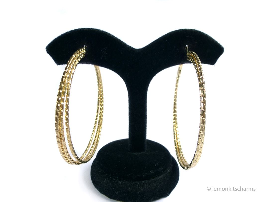 Vintage 1990s Triple Notched Hoop Pierced Earrings, er2686-ci (Category: Earrings) located in Singapore. Submitted by lemonkitscharms (Listing ID 1379695352, Image 3). Description: Vintage 1990s Triple Notched Hoop Earrings, for pierced ears. Good condition, slight darkening on goldtone from age. Goldtone, large hoops made of three wires with a notched texture. Suitable for thick earlobes as the distance between lever and posts is wide. Price exc