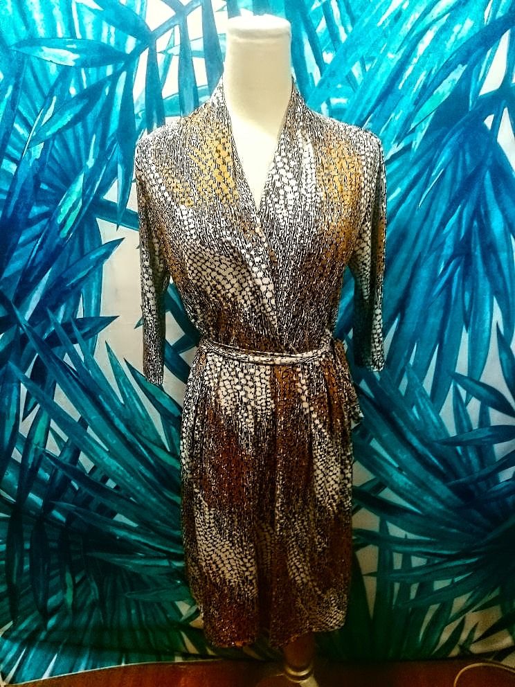 Gold Brown White Wraparound Dress LARGE (Category: Dresses) located in Quezon City. Submitted by katebutters (Listing ID 1384100443, Image 1). Description: Gold, brown, white, wraparound dress with waist tie/sash. Abstract geometric design. Wears like a painting, 3/4 sleeves, falls below the knee, very classy when accessorized with gold jewelry. Lightly used. Breezy light material (hinde mainit). LARGE size but will fit Medium and XL also (size u