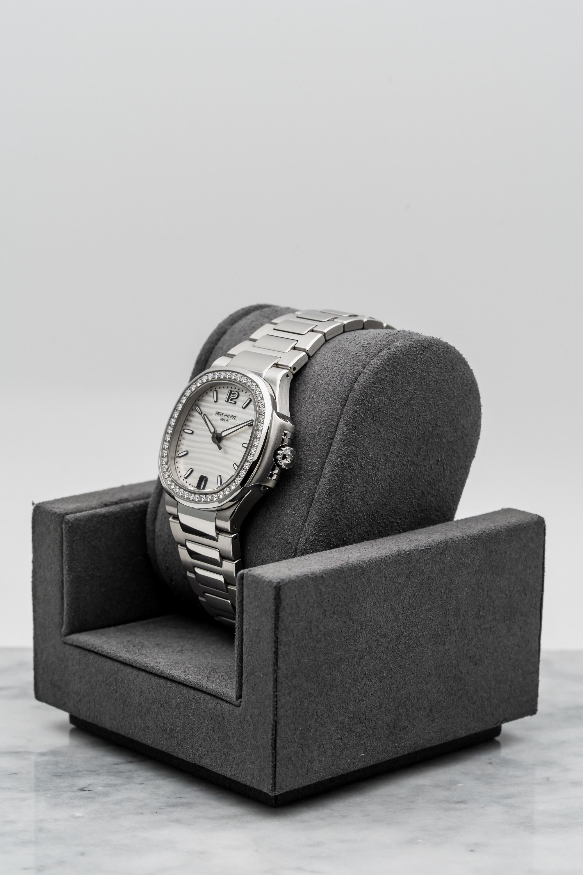 Patek Philippe Nautilus 7018/1A-001 – Ladies White Dial, Diamond Bezel • Watch Only (Category: Watches) located in Singapore. Submitted by timetells (Listing ID 1384104585, Image 2). Description: Brand: Patek Philippe Model: Nautilus Reference Number: 7018/1A-001 Year: Unknown Case Size: 33.6mm Case: Stainless Steel Dial: Silvery White with Horizontal Embossing & Date at 6 Strap: Stainless Steel Bracelet with Nautilus Folding Clasp Movement: Auto