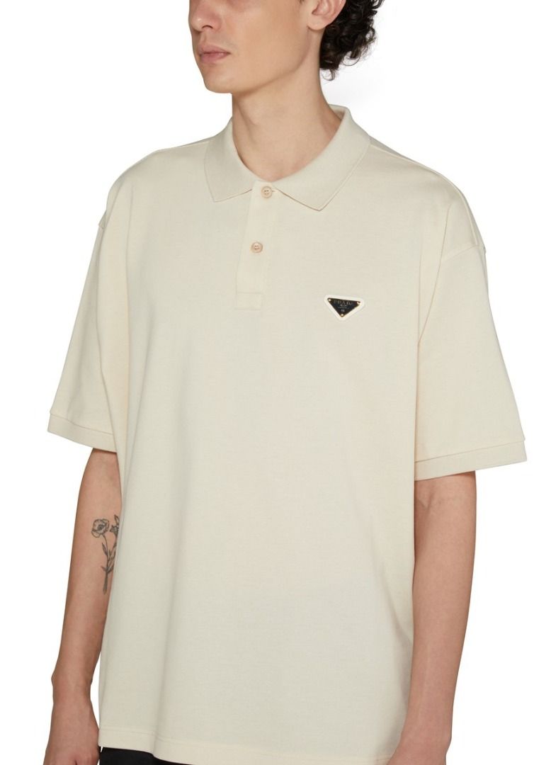 Prada Pique Polo Shirt (Category: Luxury Accessories) located in Davao. Submitted by vip.blvd (Listing ID 1382765780, Image 1). Description: Prada Pique Polo Shirt S DIMENSIONS Chest 23 Shoulder 20 Sleeves 8 Length 25 (Front) Length 26 (Back) ✅ 100% Authentic ✅ Almost brand new (10/10 perfect condition guaranteed) ✅ This item was checked-in, box and paper bag not longer included ✅ Can VC upon shipment ✅ Money-back if fake Selling Price: 8,000 Ret