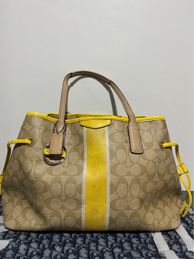 COACH SIGNATURE STRIPE DRAWSTRING CARRYALL (Category: Luxury Bags & Wallets) located in San Fernando. Submitted by gemsfndr (Listing ID 1384095826, Image 1). Description: Guaranteed Authentic With visible flaws sa front, but overall still in good condition With provided dustbag and Coach paperbag Slightly Negotiable ✨.