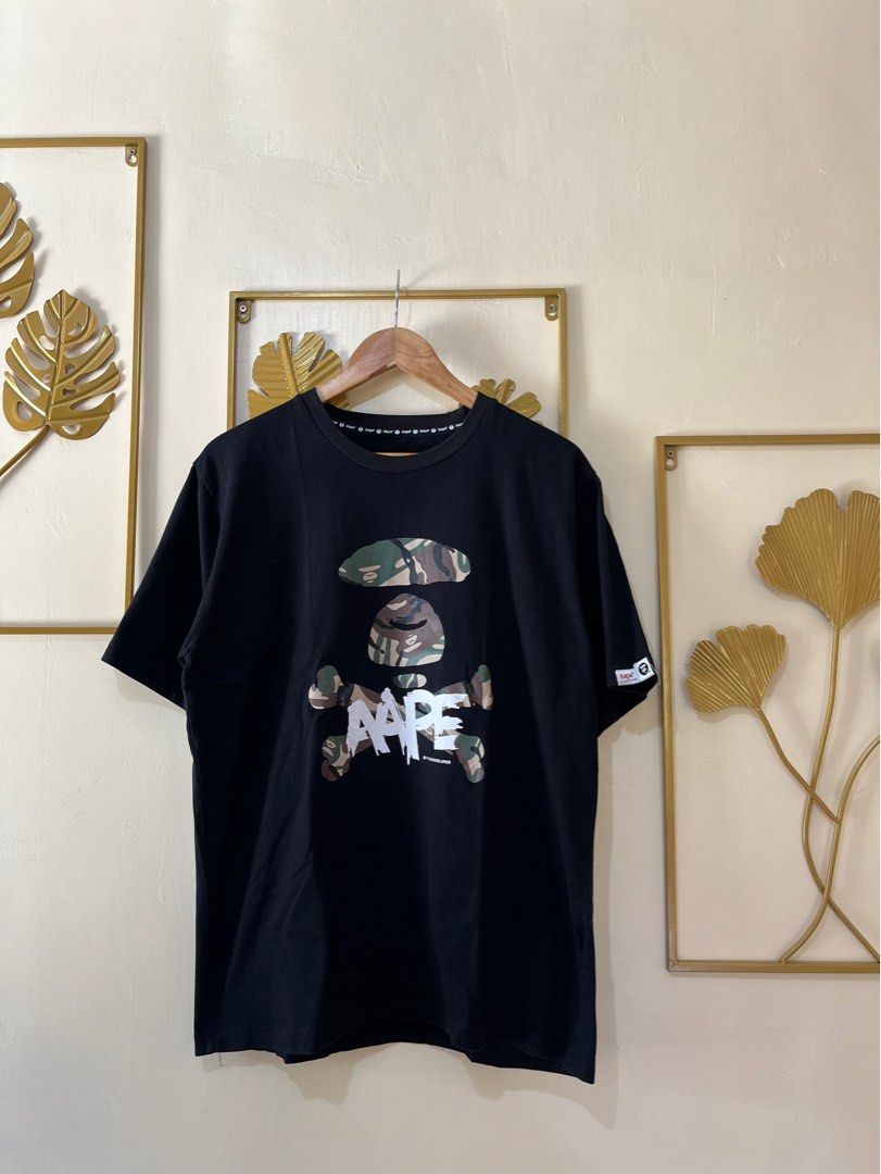 Aape Crossbone Camo Shirt (Category: Tshirts & Polo Shirts ) located in Manila. Submitted by codearchivez (Listing ID 1385827654, Image 1). Description: AAPE Crossbone Camo Shirt Size: Large (Pit to pit: 22” | Length: 28”) Condition: 9/10 – Excellent; cut tag ₱800 | Curated by Code: Archive 📦 Ships nationwide | DM to reserve .