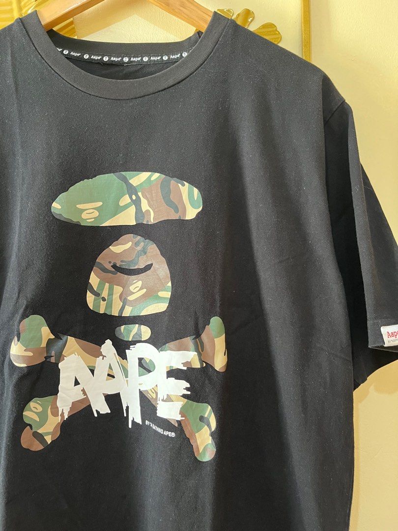 Aape Crossbone Camo Shirt (Category: Tshirts & Polo Shirts ) located in Manila. Submitted by codearchivez (Listing ID 1385827654, Image 2). Description: AAPE Crossbone Camo Shirt Size: Large (Pit to pit: 22” | Length: 28”) Condition: 9/10 – Excellent; cut tag ₱800 | Curated by Code: Archive 📦 Ships nationwide | DM to reserve .