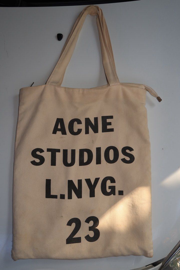 Acne Studios Tote Bag (Category: Tote Bags) located in Manila. Submitted by talisman_lei (Listing ID 1385981947, Image 1). Description: Lightly used Acne Studios Tote bag, perfect for your daily essentials, has 1 separate compartment on the inside and 1 more outside and main zipper at the top to clearly protect your belongings, this tote bag is perfect for you!.