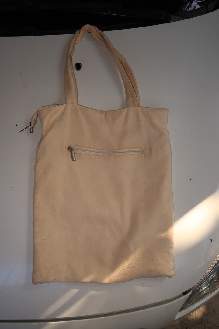 Acne Studios Tote Bag (Category: Tote Bags) located in Manila. Submitted by talisman_lei (Listing ID 1385981947, Image 3). Description: Lightly used Acne Studios Tote bag, perfect for your daily essentials, has 1 separate compartment on the inside and 1 more outside and main zipper at the top to clearly protect your belongings, this tote bag is perfect for you!.
