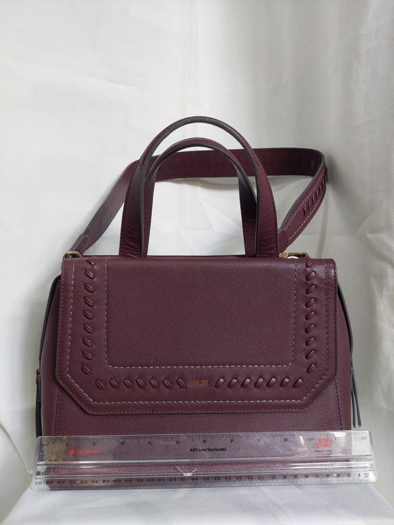 BE_GE Handbag/Shoulder bag in BURGUNDY (Category: Shoulder Bags) located in Davao. Submitted by declutteeeeeeer (Listing ID 1385836615, Image 1). Description: Burgundy color. This is a PRELOVED item. Please manage your expectations..