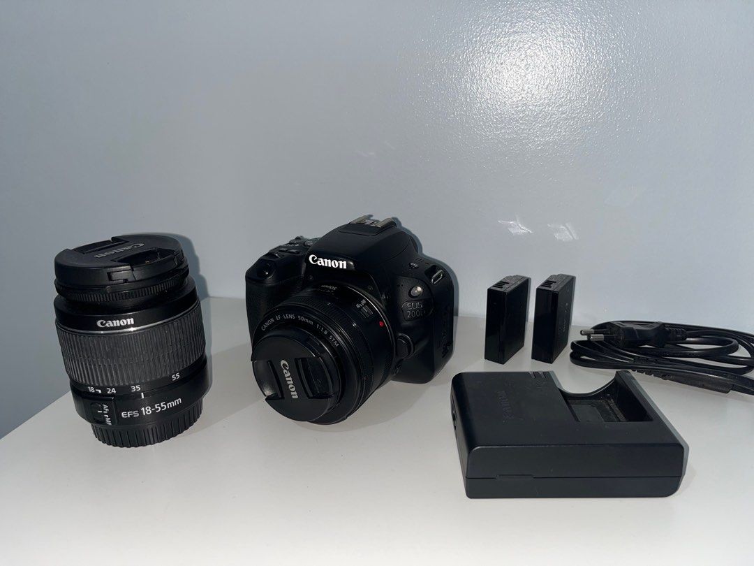 Canon EOS 200 D (Category: Cameras) located in Mandaluyong City. Submitted by shopdejord (Listing ID 1385953073, Image 2). Description: Canon EOS 200D (Package) Canon EF-S 18 - 55mm Canon EF-50mm 1.8 STM (5, 500 Php) 2 Original Canon Battery Packs 1 Charger Cable 1x 16GB SD Card Notes: - 3 rubber grommet covers for the ports are missing (Parts for this are easily available online) - All hardware and software features are fully functional. - The c