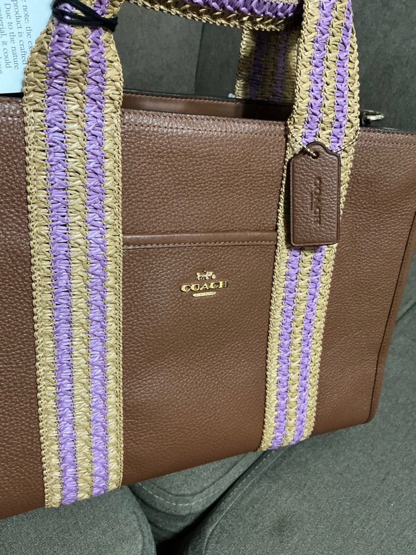 Coach Straw Webb Smith Tote - Medium (Category: Luxury Bags & Wallets) located in San Pedro. Submitted by misslumi (Listing ID 1385907708, Image 3). Description: Brand New from Canada!! - Medium size. - Redwood Multi color - Open tote with magnetic closure. - with slim leather crossbody strap. - Fits ipad pro 13" - Fits 13" laptops Style Number CBG90 Measurements Length: 13.5" Height: 10.0" Width: 5.0" Materials Refined pebble leather Handle Hand