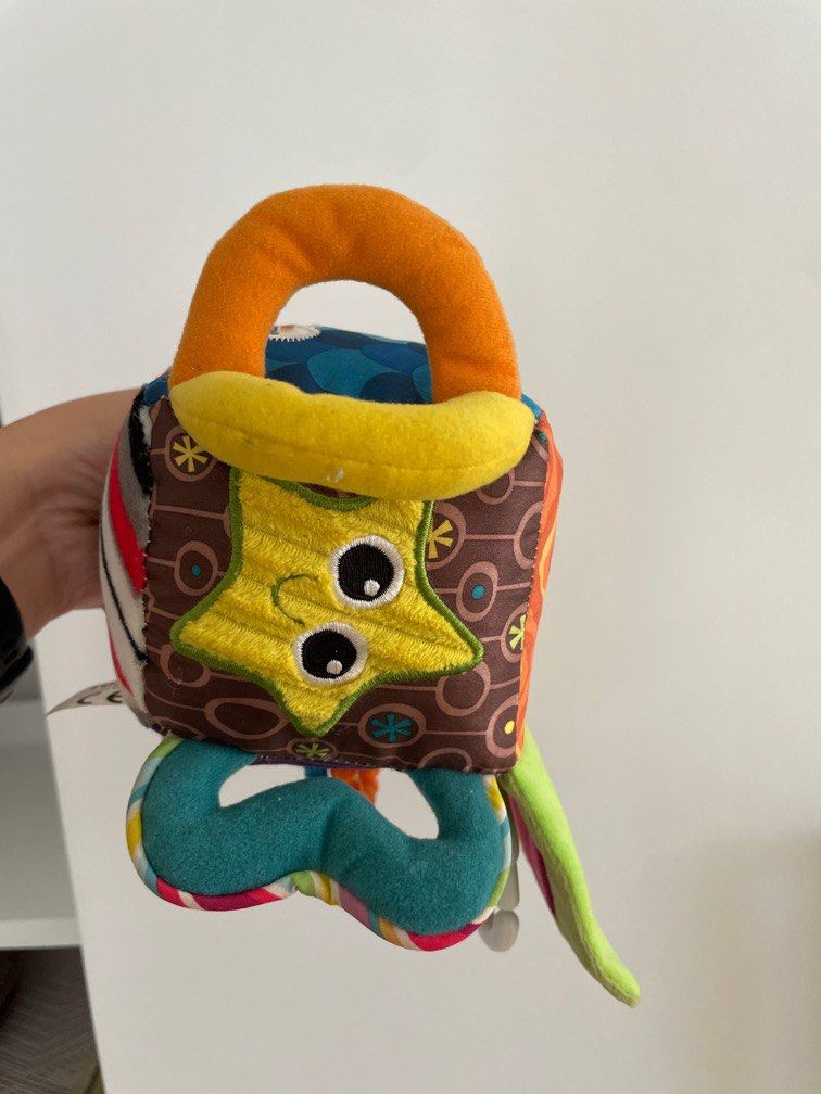 Lamaze Clutch Cube Toy (Category: Infant Playtime) located in Makati City. Submitted by jestangan (Listing ID 1385839513, Image 3). Description: Item wasn’t really used just stored. It will be UV sterilized before shipping out. I can send via LBC. Shipping c/o buyer..