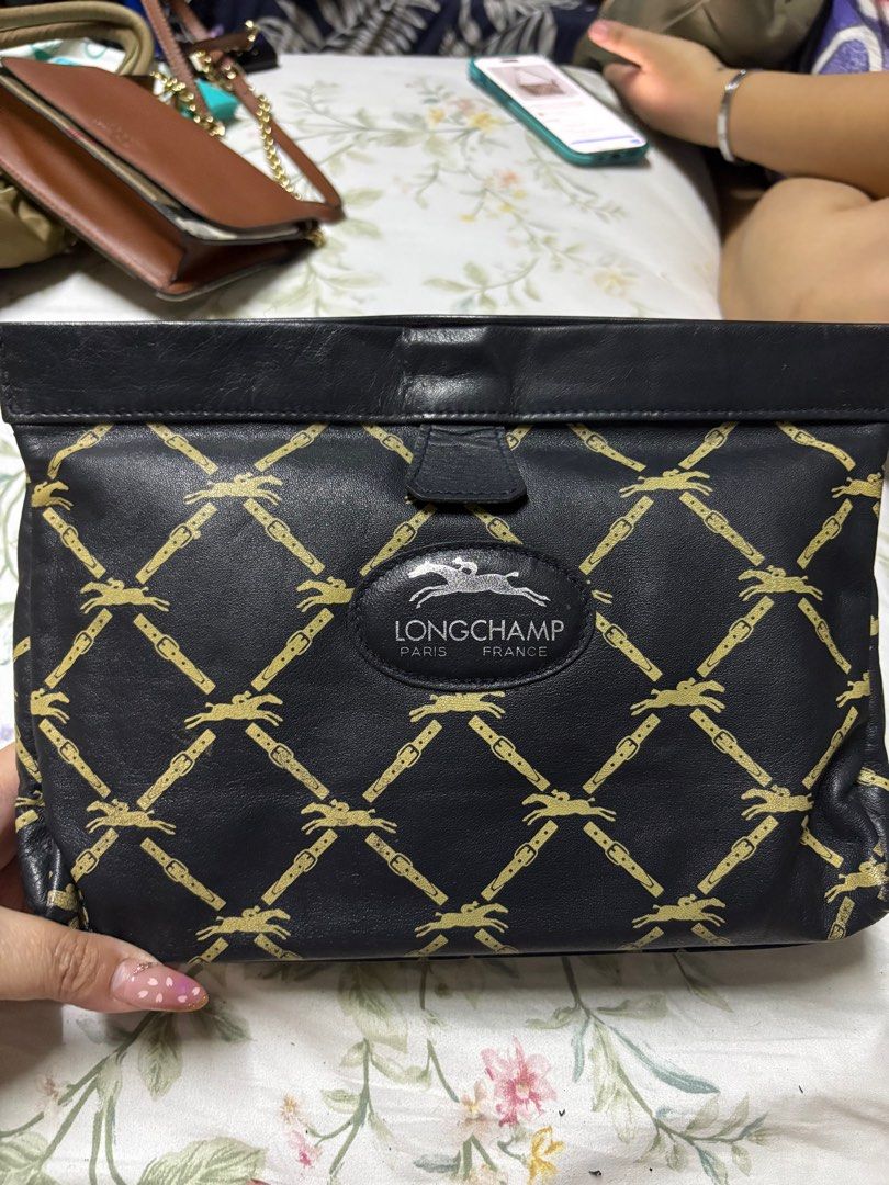 Longchamp clutch (Category: Luxury Bags & Wallets) located in Paranaque City. Submitted by shopofashopaholic (Listing ID 1385988824, Image 1). Description: Authentic and vintage Good condition, no flaws.