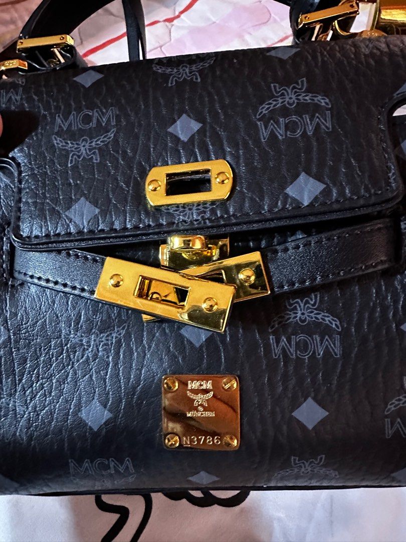 MCM Mini Heritage Satchel (Category: Luxury Bags & Wallets) located in Manila. Submitted by bchrssm (Listing ID 1385880785, Image 2). Description: Inclusions: Dust bag Lock and key Sling.
