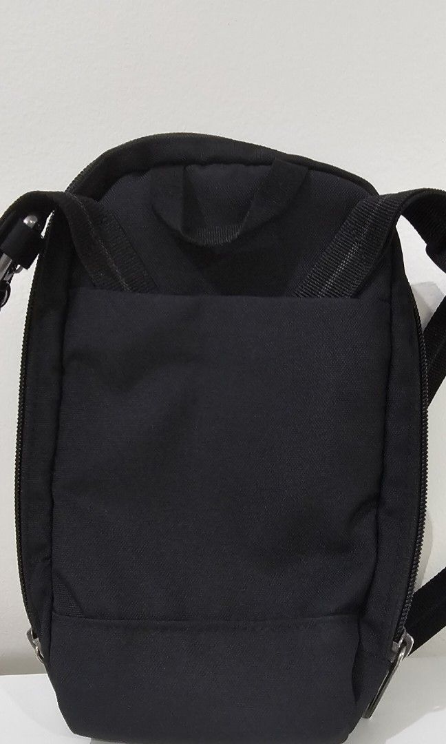 Pacsafe RFIDSafe Tech Crossbody Bag (Category: Sling Bags) located in Pasig City. Submitted by bubbles108 (Listing ID 1385945386, Image 2). Description: Features: *Made from recycled PET for sustainability *Water repellent shell fabric *Fits a folded boarding pass *Organization for your cables and USBs *Passport pocket with RFID blocking to protect your personal details *3 card slots *Internal pockets to keep your gear organized *Internal attachm