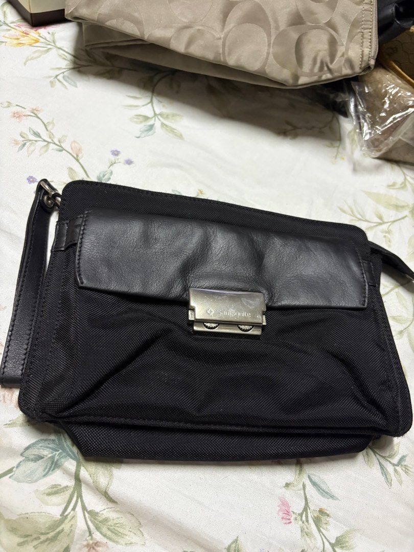 Samsonite clutch (Category: Luxury Bags & Wallets) located in Paranaque City. Submitted by shopofashopaholic (Listing ID 1385974040, Image 1). Description: Samsonite clutch Front pocket can be locked via number codes. Material is combination of leather and sturdy canvas. Length/height: 10 x 7 inches Gently used, no flaws..