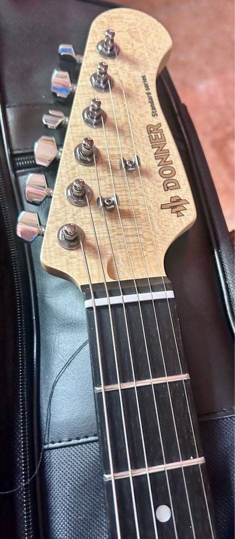 Electric Guitar Stratocaster Donner (Category: Musical Instruments) located in Paranaque City. Submitted by dominiclorico (Listing ID 1385825018, Image 3). Description: Electric Guitar Donner Stratocaster DST 100 Donner Guitar is sold in the US , UK, multiple countries and distributed by RJ Guitars Philippines. Very good guitar at an affordable price. Sounds really good. Stratocaster with tobacco sunburst color. For me, this is better than Squier