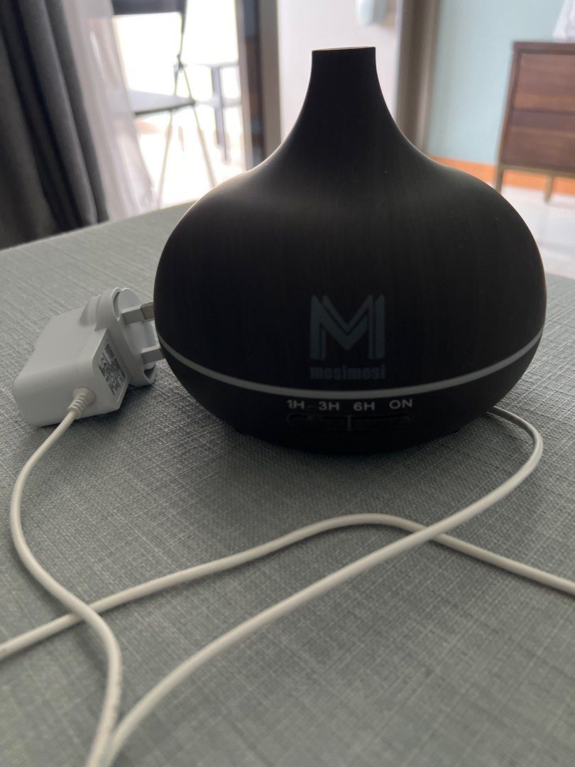 Aroma Diffuser (Category: Home Fragrance) located in Singapore. Submitted by sithumdissa (Listing ID 1386058554, Image 1). Description: - Stylish aroma diffuser - Timer settings: 1H, 3H, 6H, ON - Includes power adapter - Creates a relaxing atmosphere - Excellent condition.