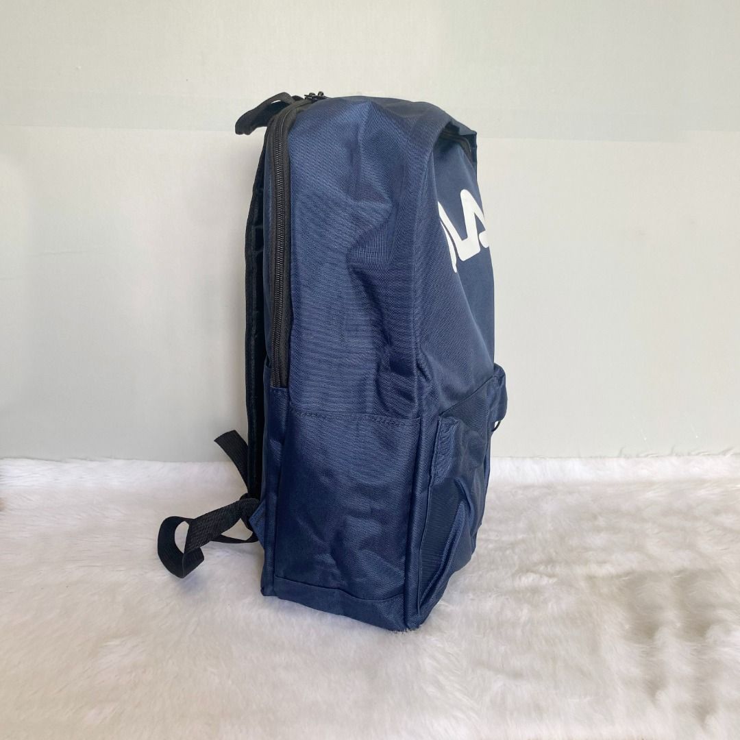 Fila Large Blue Nylon Backpack (Category: Backpacks) located in Cebu City. Submitted by posh_avenue888 (Listing ID 1386182344, Image 2). Description: In very good condition. From Japan. Crafted in thick durable nylon. 100% authentic!!! 12" x 16" x 5".