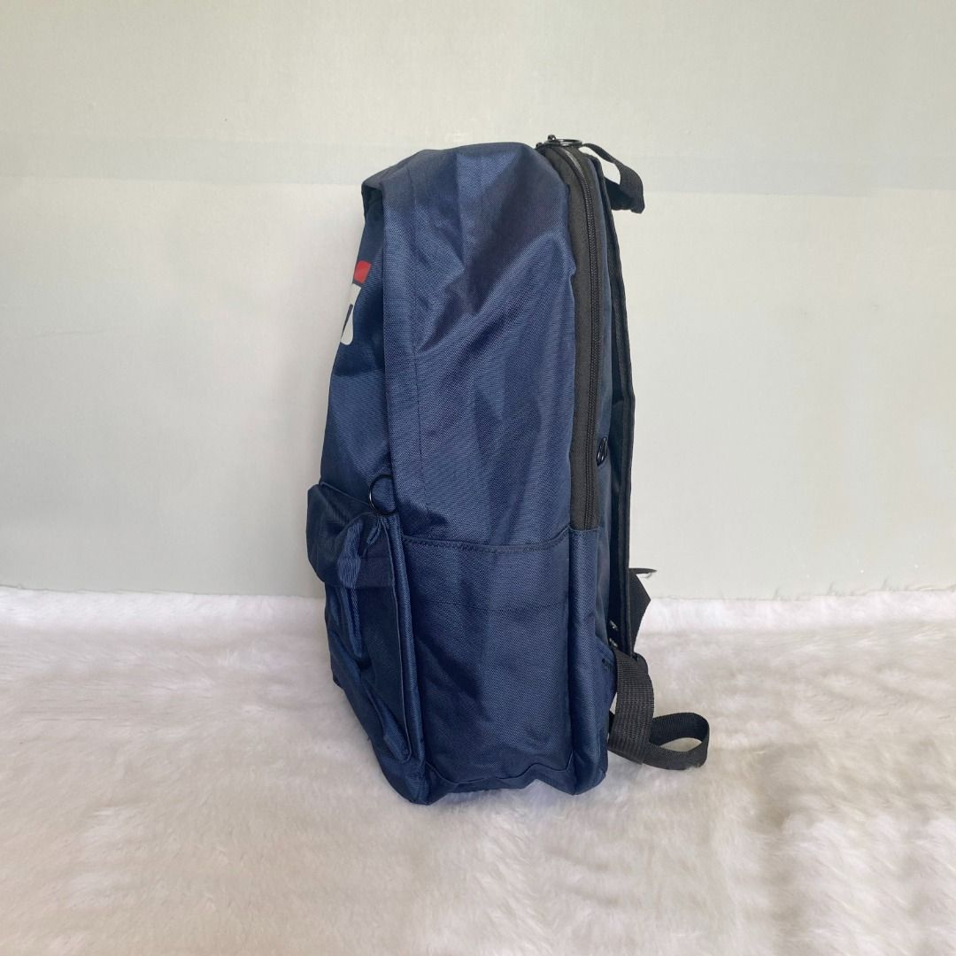 Fila Large Blue Nylon Backpack (Category: Backpacks) located in Cebu City. Submitted by posh_avenue888 (Listing ID 1386182344, Image 3). Description: In very good condition. From Japan. Crafted in thick durable nylon. 100% authentic!!! 12" x 16" x 5".