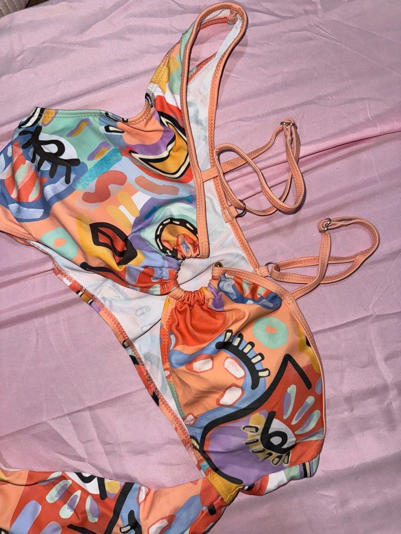 One-Piece Orange Cut-Out Swimsuit (Category: Bikinis & Swimsuits) located in Manila. Submitted by cesna_ (Listing ID 1386108109, Image 2). Description: • Brand new, unused, but washed • Size: Large • Stylish cut-out design • Orange in color .