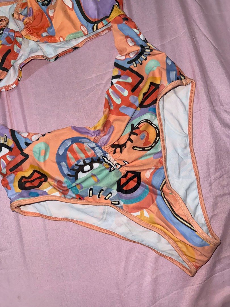 One-Piece Orange Cut-Out Swimsuit (Category: Bikinis & Swimsuits) located in Manila. Submitted by cesna_ (Listing ID 1386108109, Image 3). Description: • Brand new, unused, but washed • Size: Large • Stylish cut-out design • Orange in color .