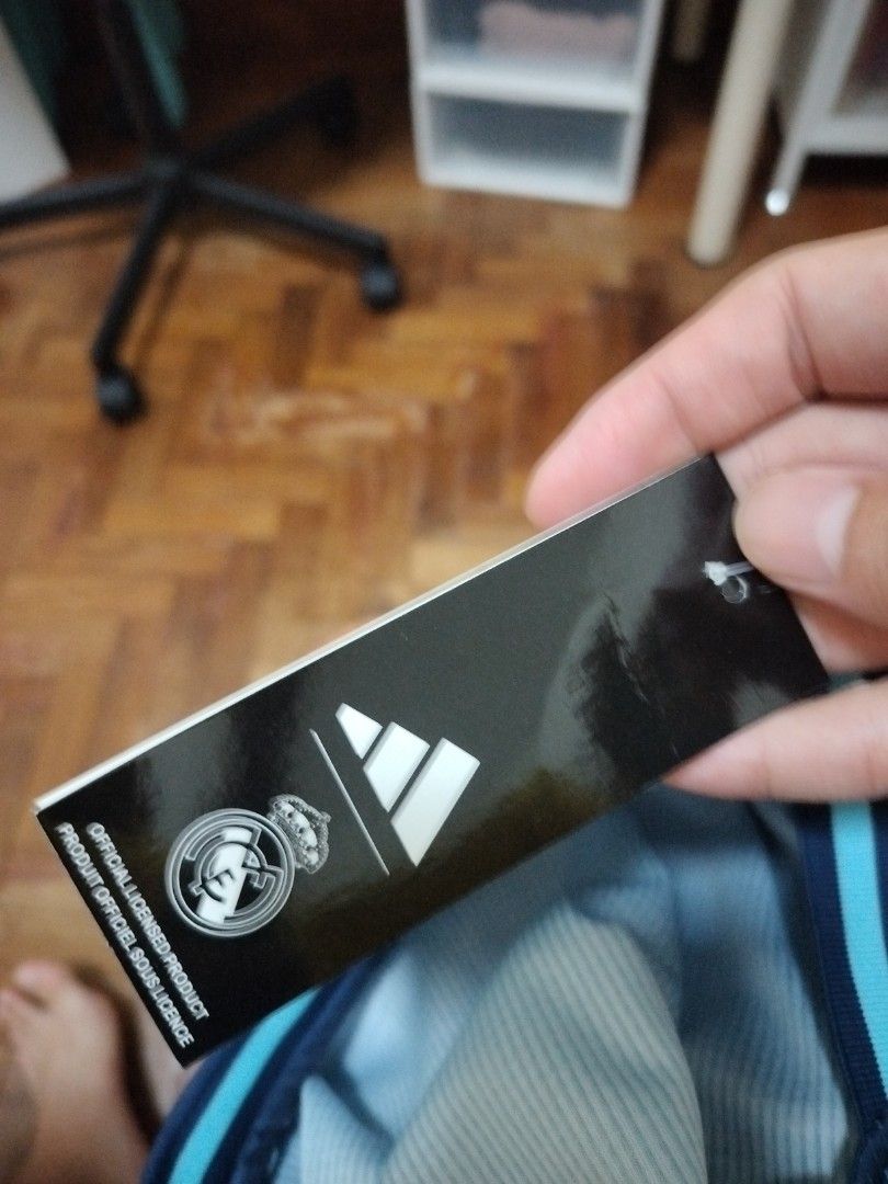 Real Madrid jersey (Category: Activewear) located in Singapore. Submitted by miwa. (Listing ID 1386170327, Image 2). Description: BNWT tracked postage with bubble mailer is $2 postage fee waived with minimum purchase of $30.